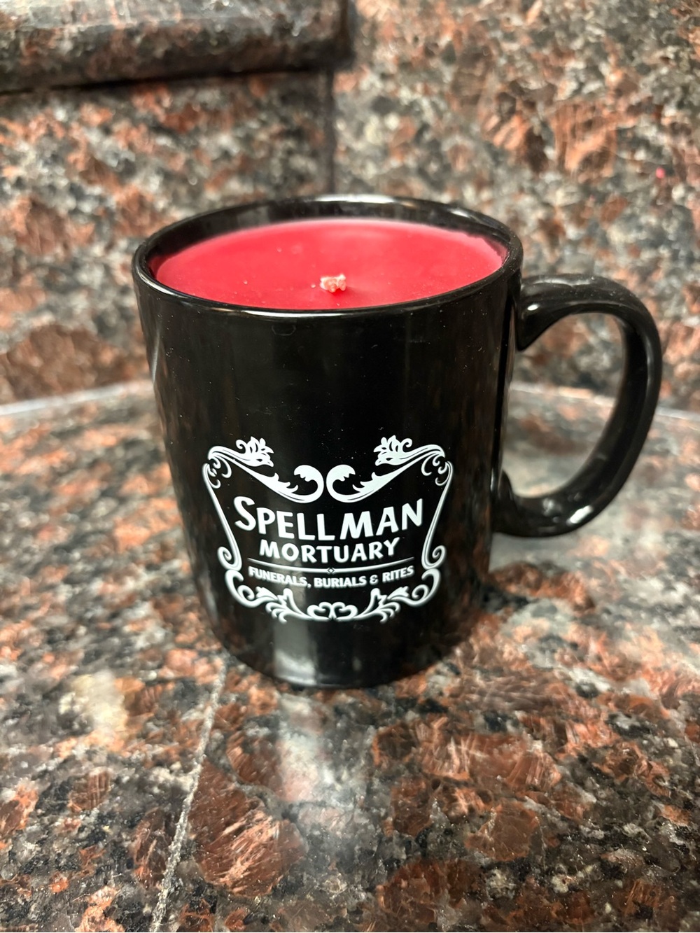 Handmade by me upcycled candle in a Spellman Mortuary black mug, scent is cherry